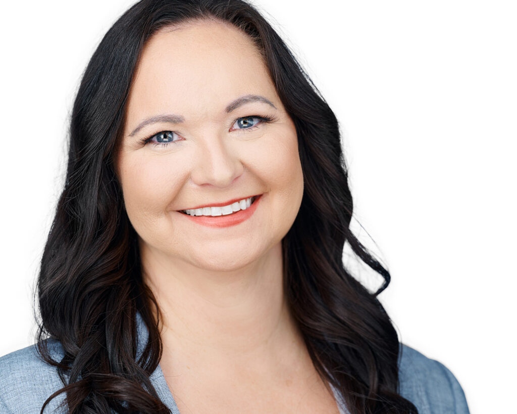 Professional business headshot of a woman on a clean white background.