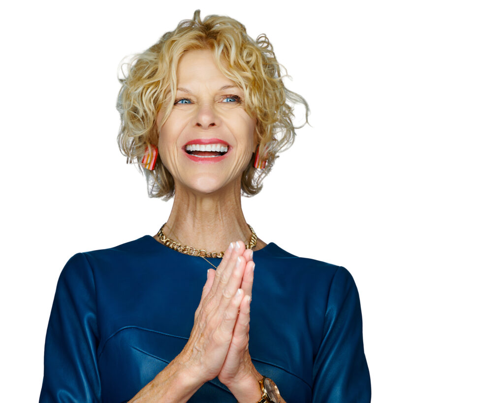 Professional woman laughing during an expressive St. Louis headshot session on a white background