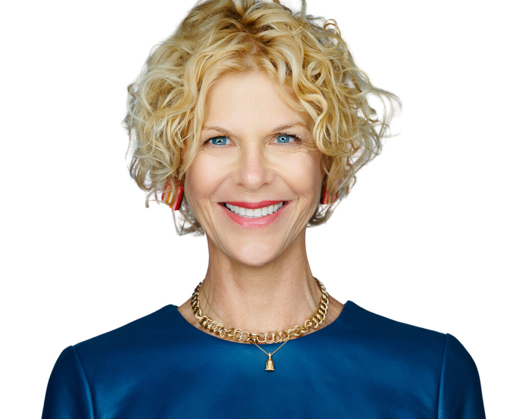 Smiling professional woman photographed on a clean white background for a St. Louis headshot
